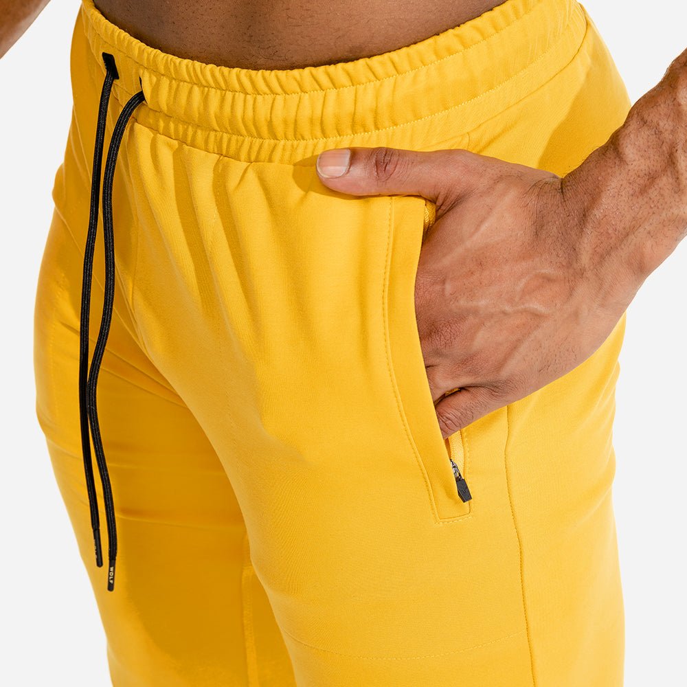 squatwolf-gym-wear-limitless-jogger-pants-yellow-workout-pants-for-men
